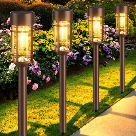 Mancra 8-pack solar outdoor lights lighting a garden path with warm glow