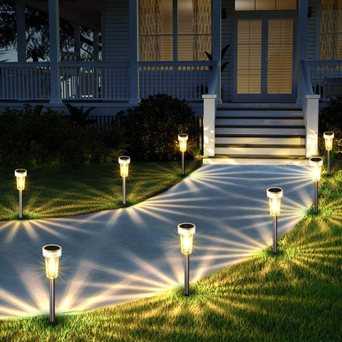 Mancra 8-pack solar lights illuminate outdoor pathways at night for safer navigation.