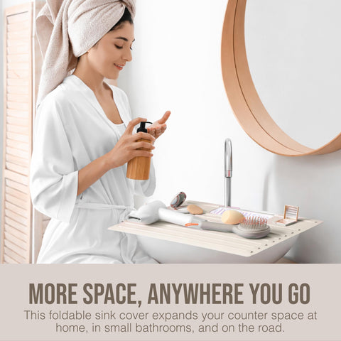 Maplefield sink cover expands counter space for makeup and grooming.