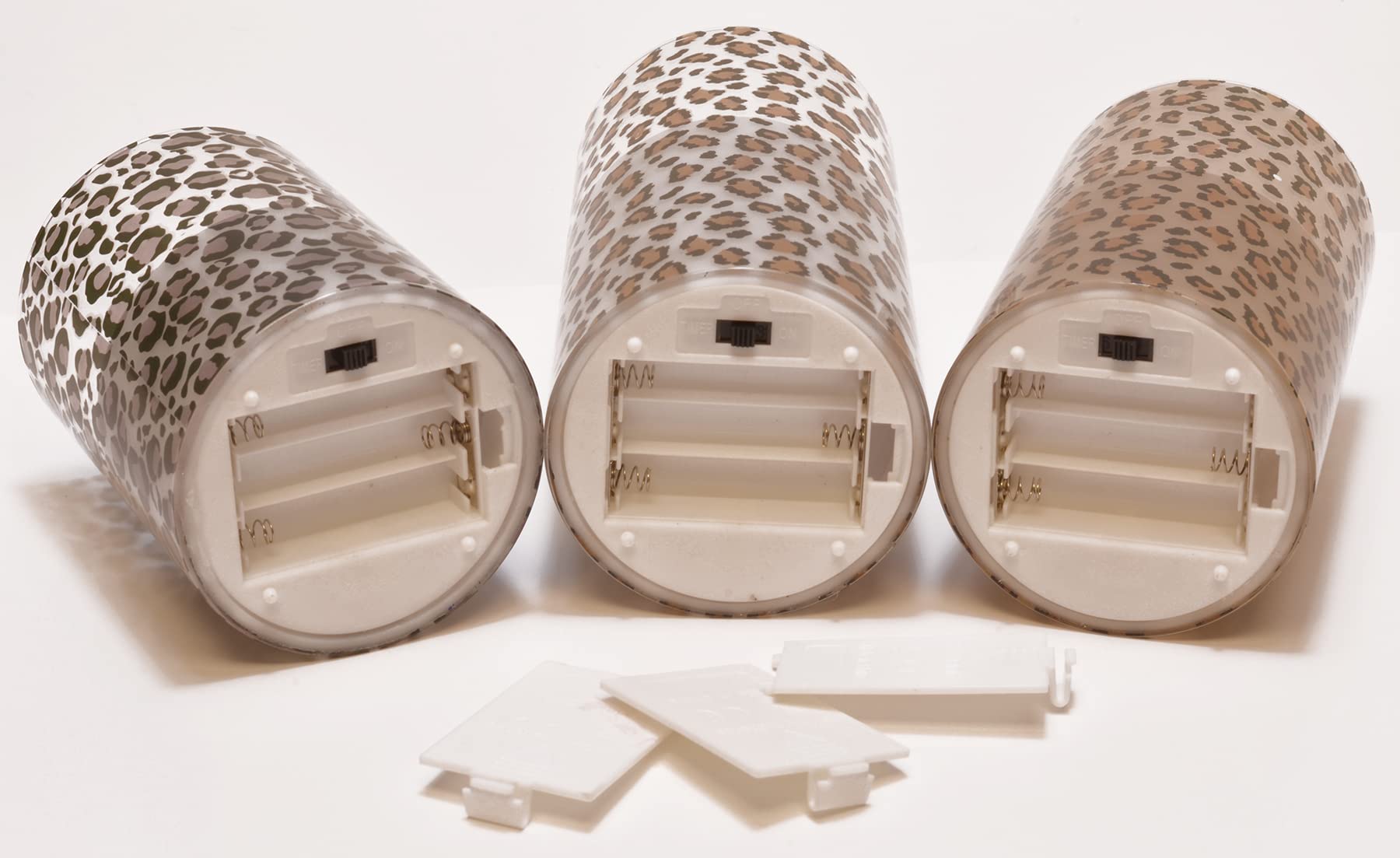 Mark Feldstein & Associates leopard pillar trio with 6-hour timers for daily routines.