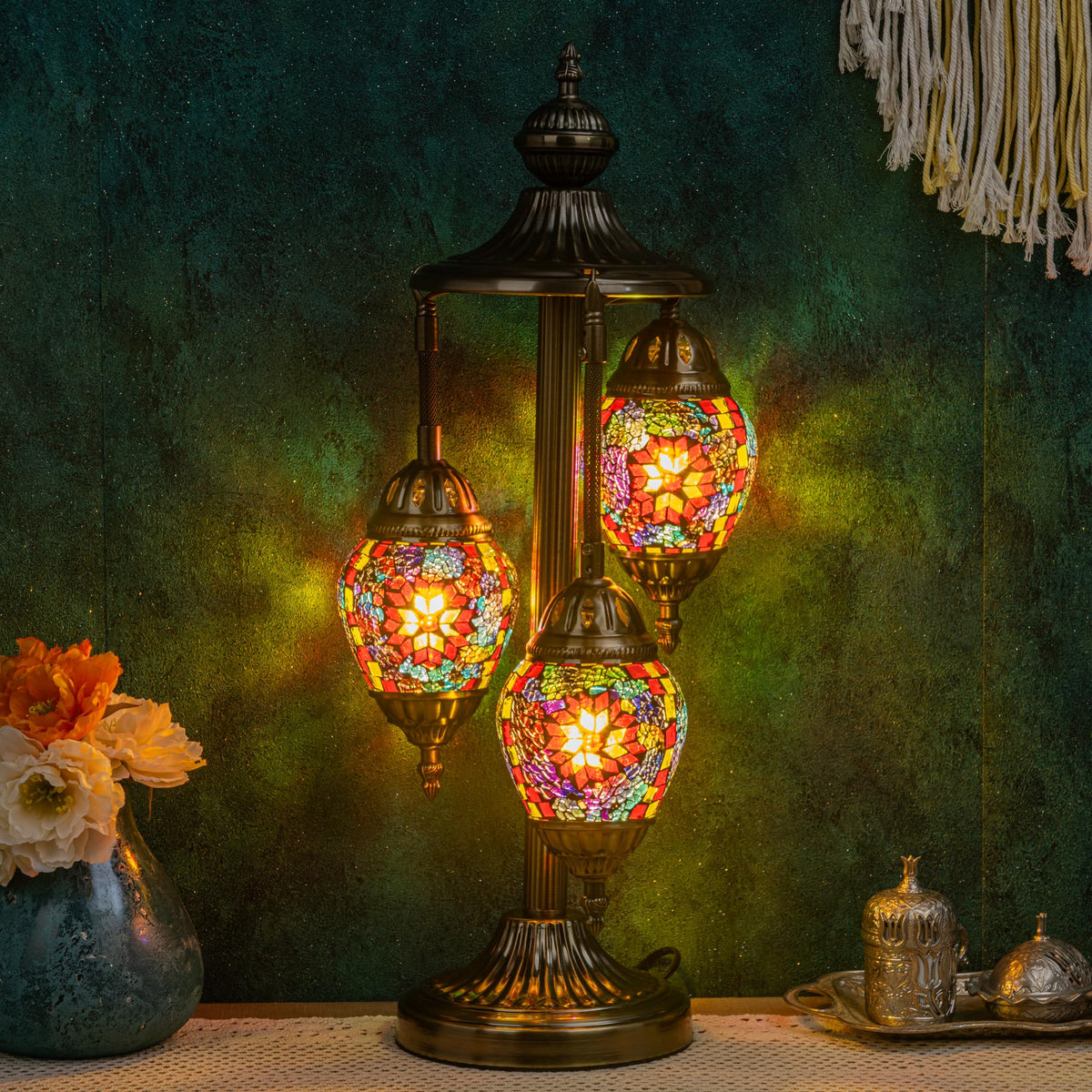 Marrakech Turkish lamp with 3 globes and bronze base enhances living room ambiance.