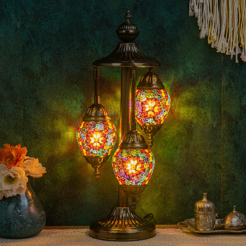 Marrakech Turkish lamp with 3 globes and bronze base enhances living room ambiance.