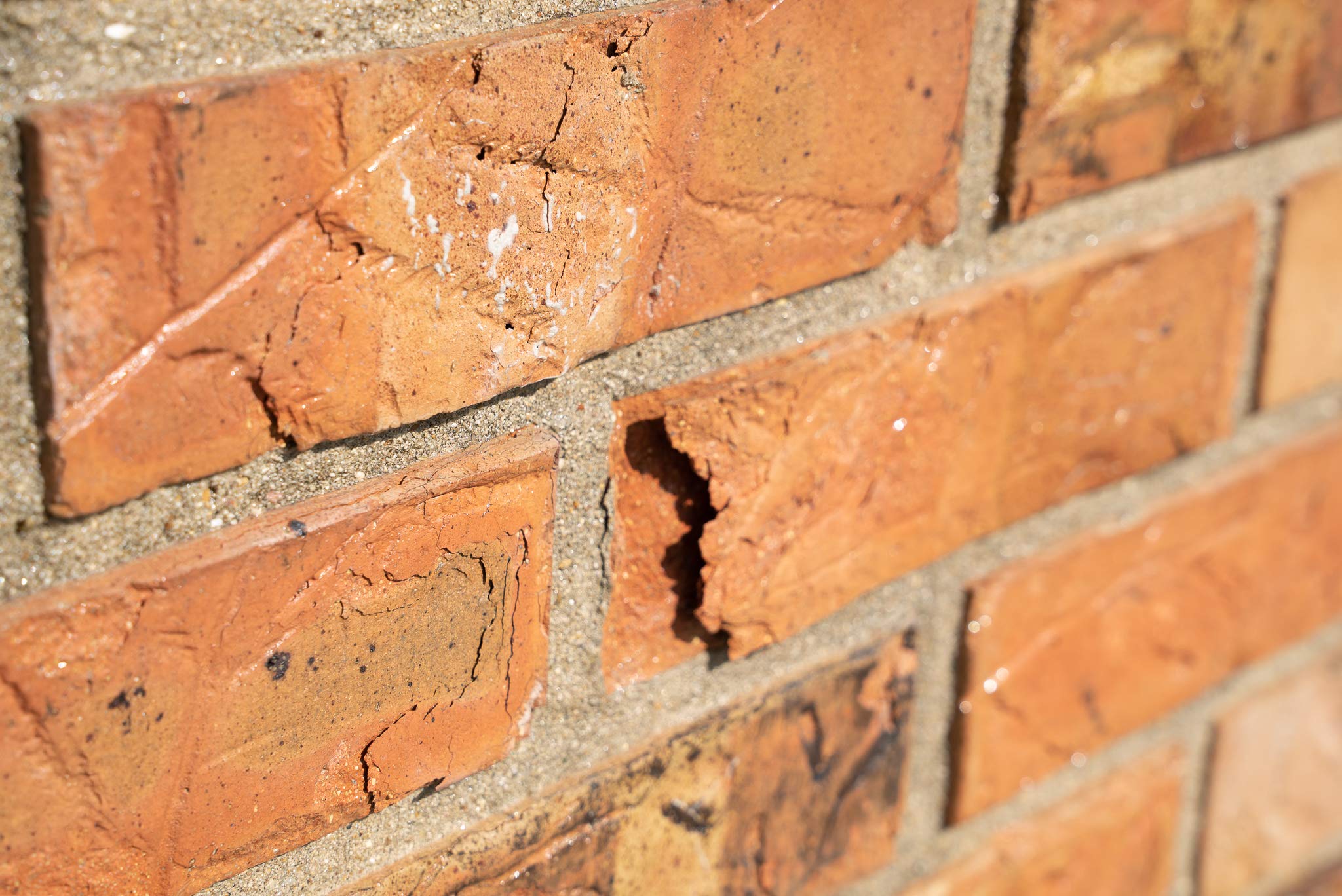 MasonryDefender close-up on brick surface shows clear, non-film coating that preserves color