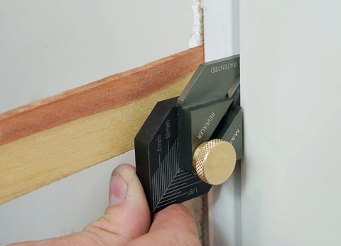 Massca Revealer right-angle guide highlights precise corner alignment for mitered frames.
