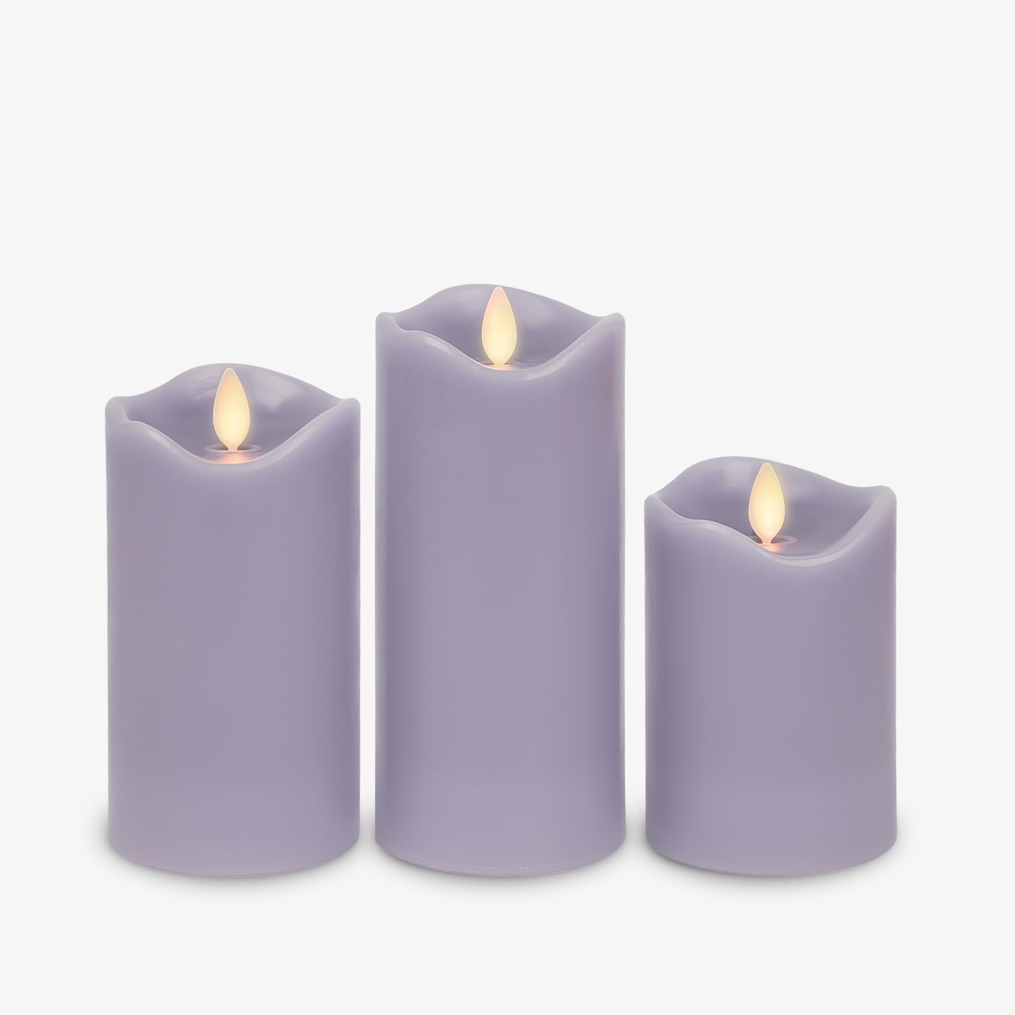 Matchless Candle Co. pastel purple pillar 3-pack lit with flickering glow for safe home décor
