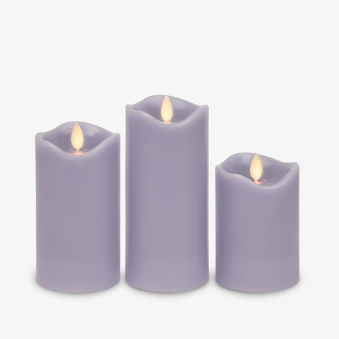 Matchless Candle Co. pastel purple pillar 3-pack lit with flickering glow for safe home décor