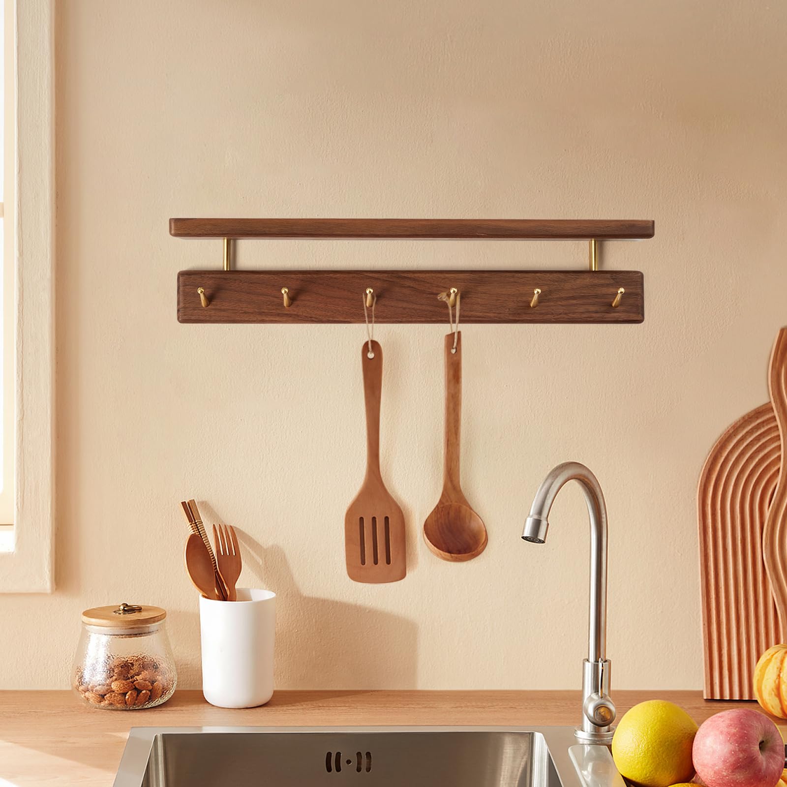 Mayhas walnut wall mount rack with brass hooks keeps entryways organized.