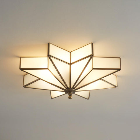 Mazu House Black Star flush ceiling light with brass glass shade enhances entry ambience.