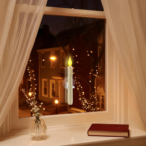 Meigic warm yellow LED candle enhances holiday window ambiance without wires