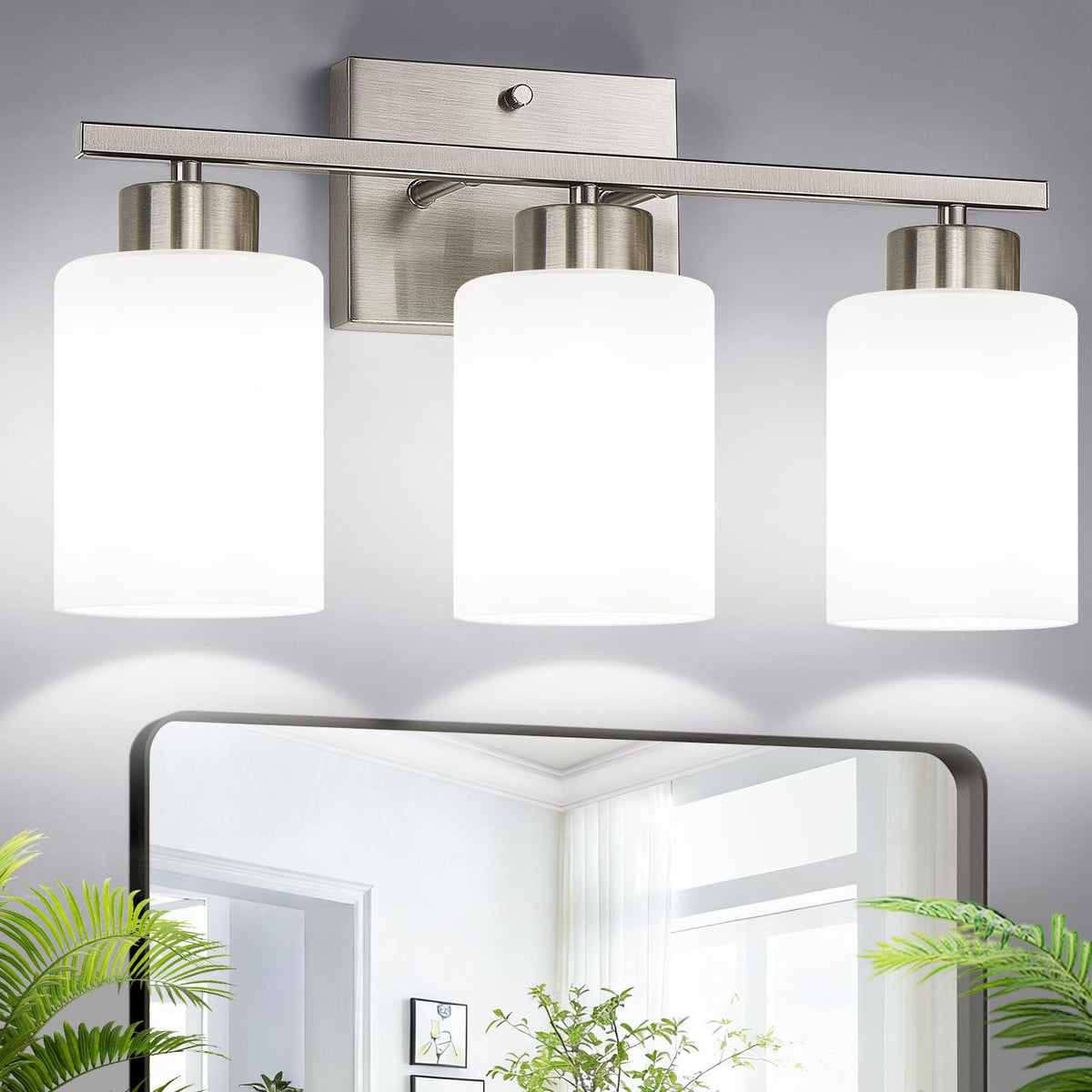 Meybiok brushed nickel three-light vanity fixture with milk glass shades over a bathroom mirror.