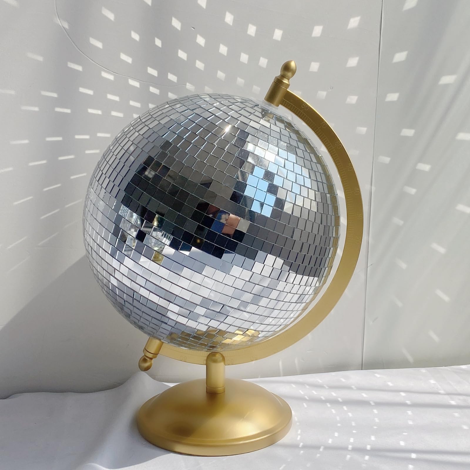 MFGDISCO gold disco ball globe on base adds modern tabletop flair.