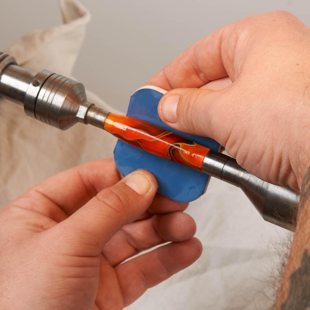 Close-up of Micro-Mesh finishing pads in use on a pen