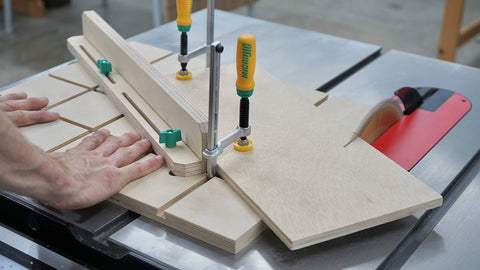 MICROJIG Matchfit clamps slide along routed tracks for fast, repeatable setups.