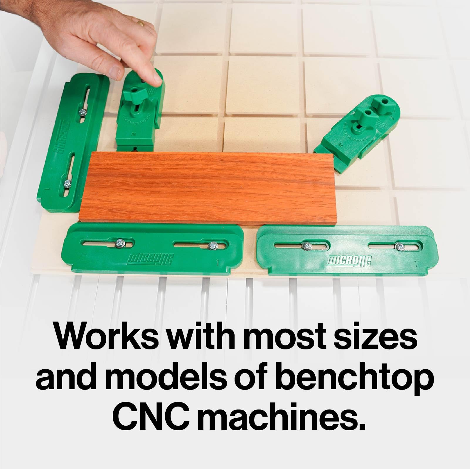 MICROJIG MatchFit dovetail spoil board enables clamp placement along edges.