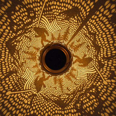 Miggley Bigfoot solar lantern garden sconce lights up garden accents.