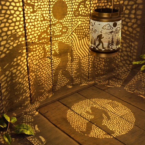 Miggley Bigfoot solar lantern on a patio table for cozy outdoor evenings.