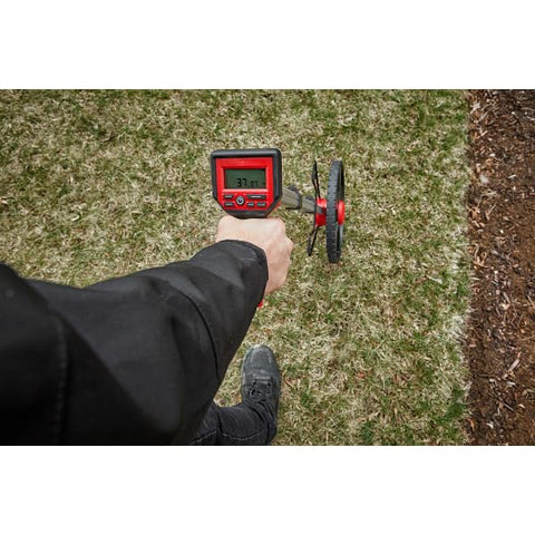 Milwaukee 12in digital measuring wheel durable body withstands daily construction use.