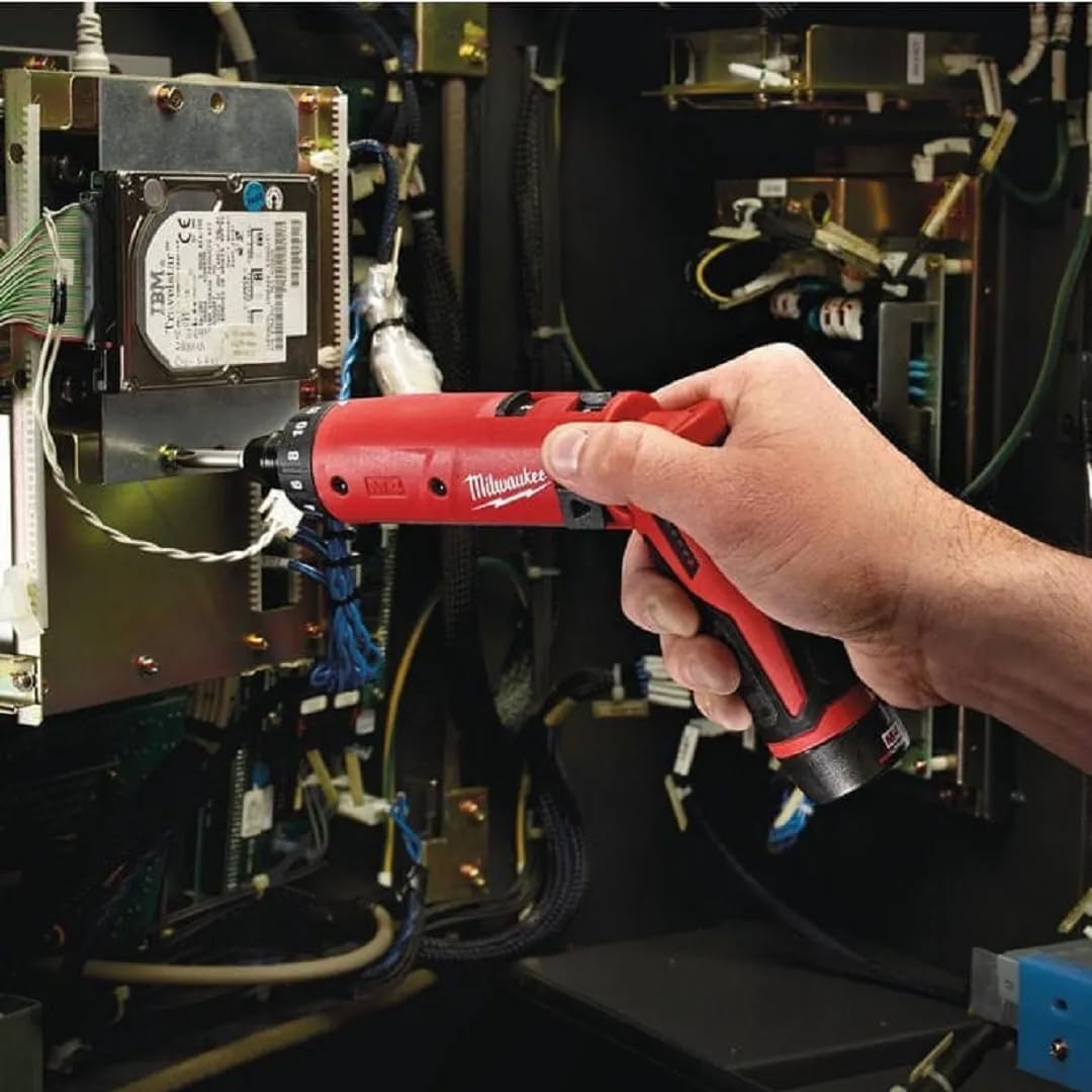Milwaukee 2101-22 M4 1/4 hex screwdriver kit in use with two batteries on-site