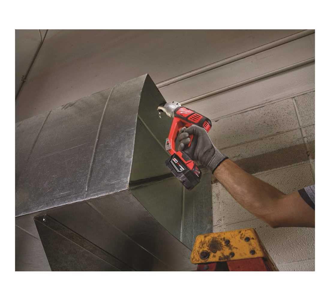 Milwaukee 2635-20 in-use cutting metal demonstrating smooth, clean edge.