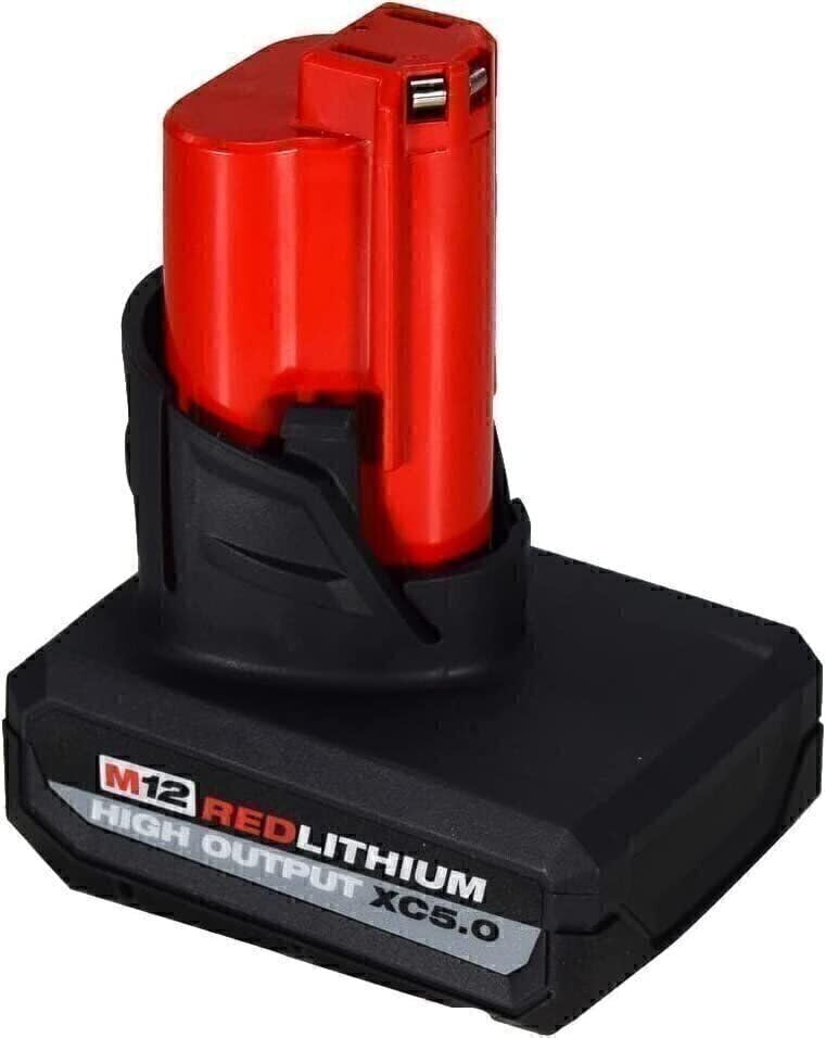 Milwaukee 48-11-2450 battery pack in use with cordless tools.