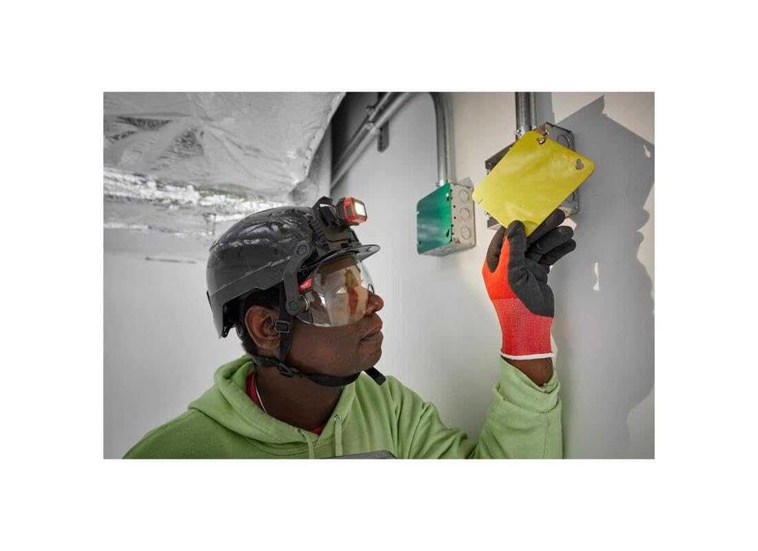 Milwaukee BOLT eye visor protective lens shielding debris in bright light