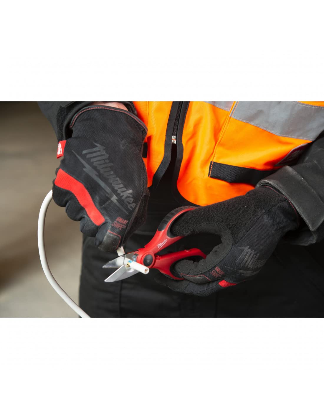 Milwaukee scissors showing built-in cable crimper for efficient on-site crimping