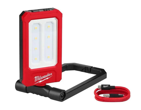 Milwaukee low-profile light on a workbench providing focused task illumination.