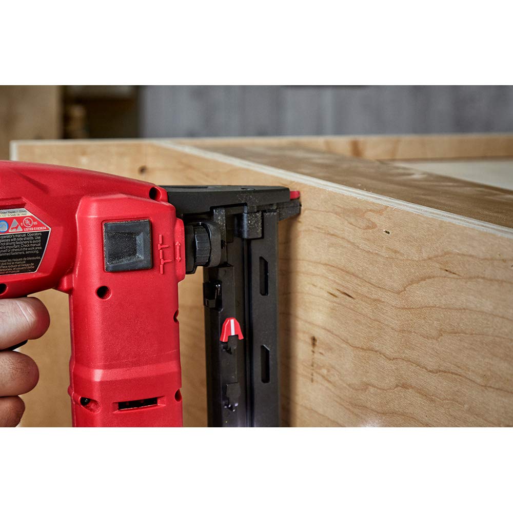 Milwaukee stapler in sequential mode enabling quick trim and finishing tasks.