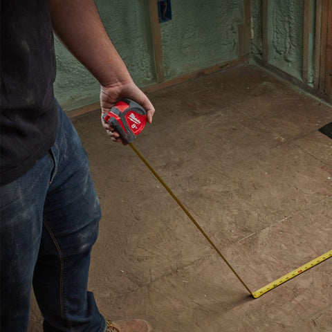 Milwaukee pro-compact on-site use demonstrating quick pull-out and lock function.