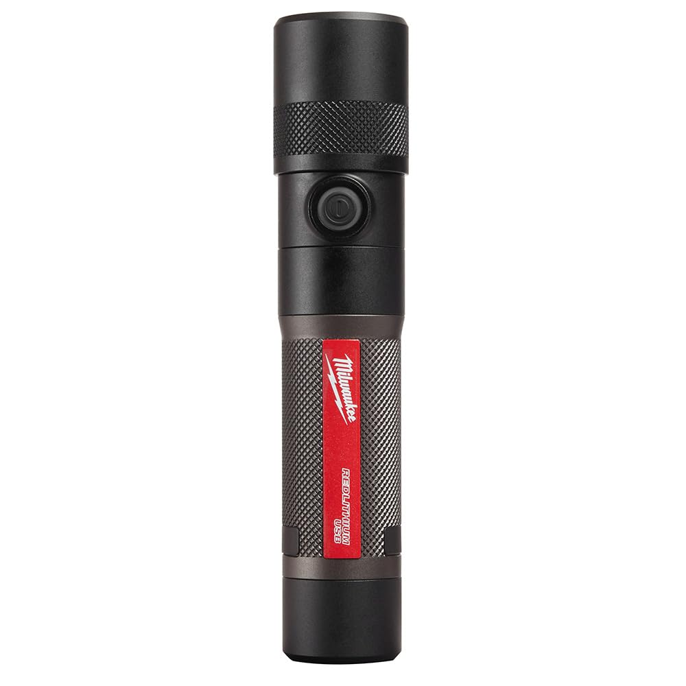 Milwaukee rechargeable 1100-lumen flashlight shows bright beam on a work site.