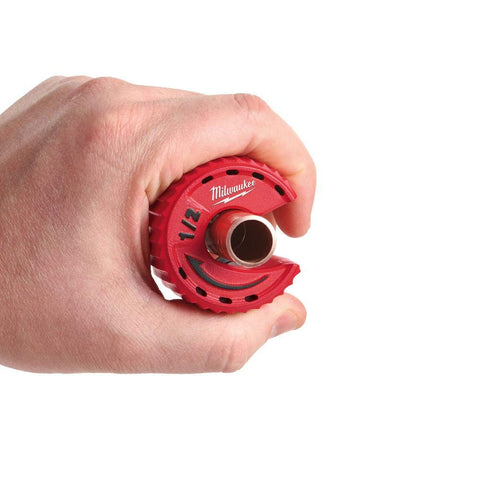 Milwaukee replaceable blade demonstrated for easy maintenance.