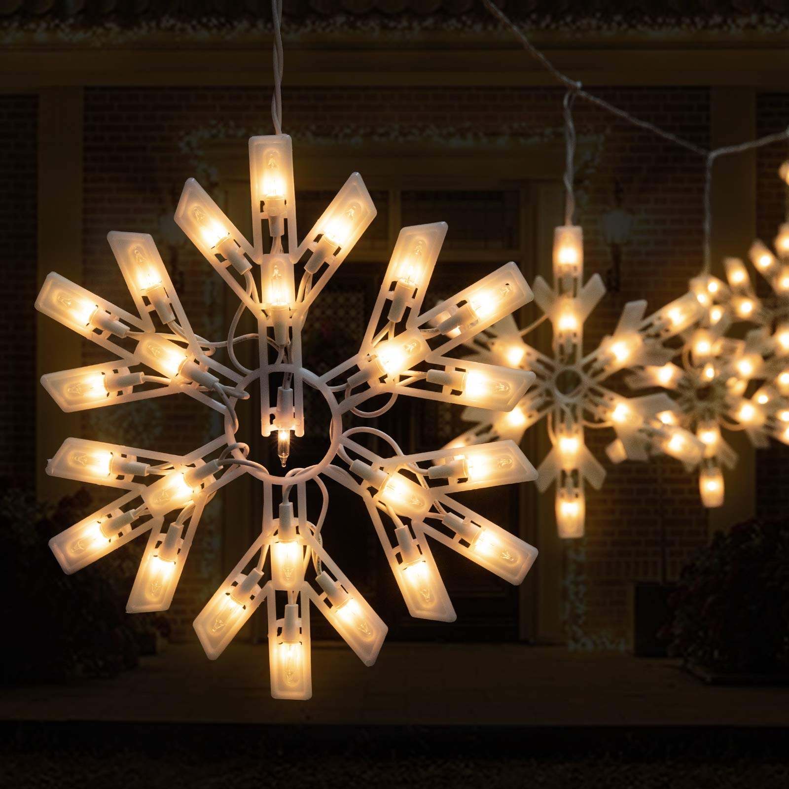 Minetom 9ft icicle lights cascade along rooflines and fences