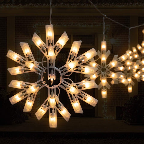 Minetom 9ft icicle lights cascade along rooflines and fences