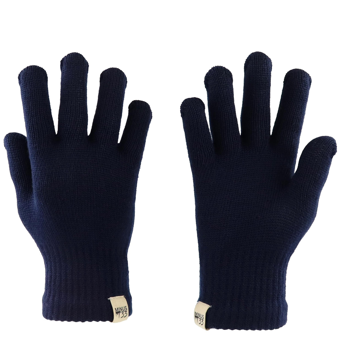 Minus33 Merino Wool Glove Liner in navy blue, worn on hand, showing snug warmth