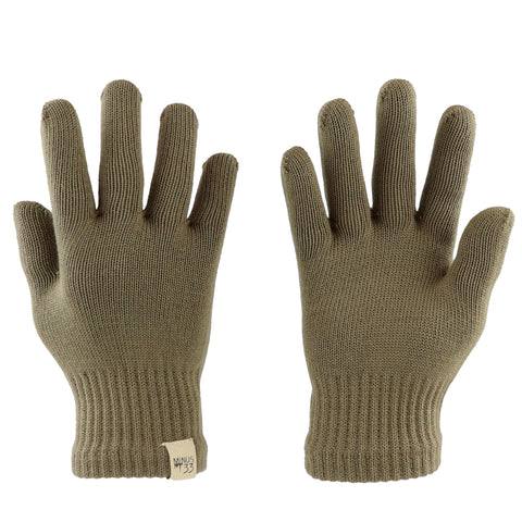 Minus33 Merino Wool Glove Liner in tan demonstrates a warm base layer for skiing or icy days.