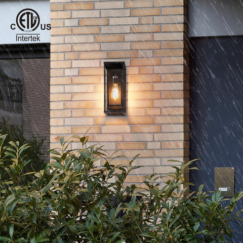 Mirrea outdoor sconce showcases vintage character at night.