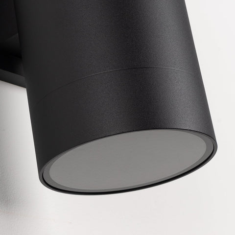 Matte black finish on Mirrea wall light enhances modern exterior design.