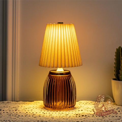 MJ PREMIER cordless lamp with pleated shade and glass base adds warm ambiance