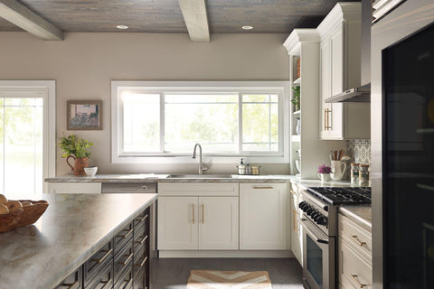 Moen Arbor pull-down sprayer demonstrates flexible reach for easy sink cleaning.