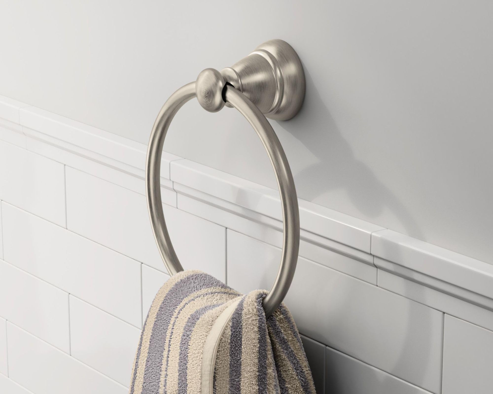 Moen Banbury pivoting toilet paper holder for easy reach and use.