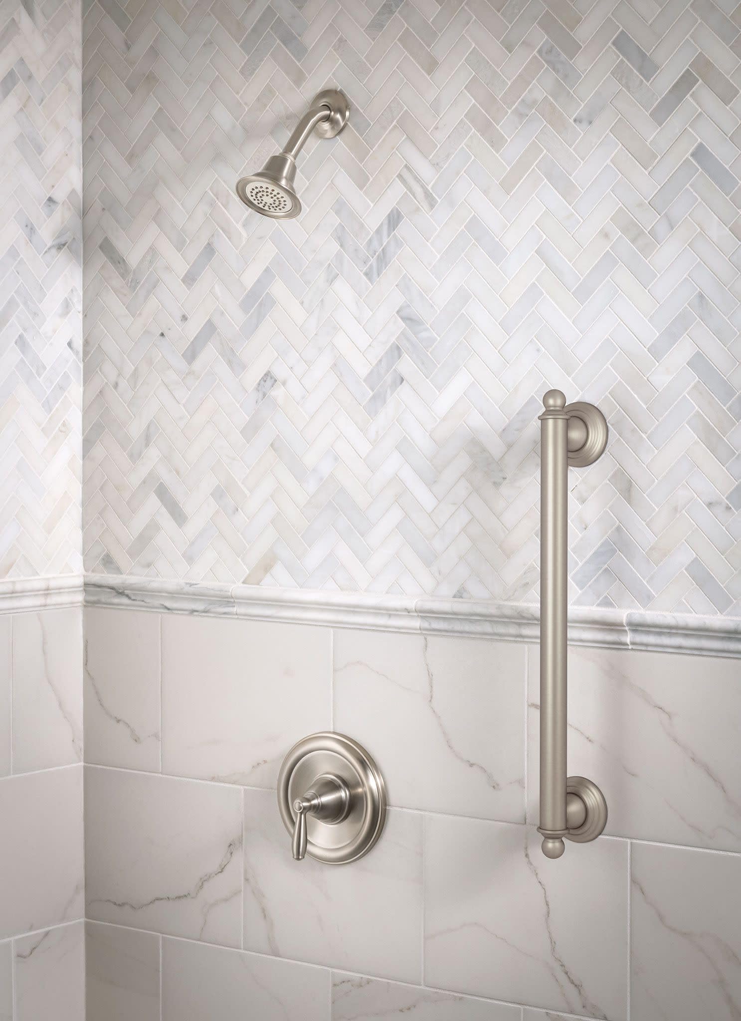 Moen Brantford brushed nickel trim handle close-up highlights smooth operation.