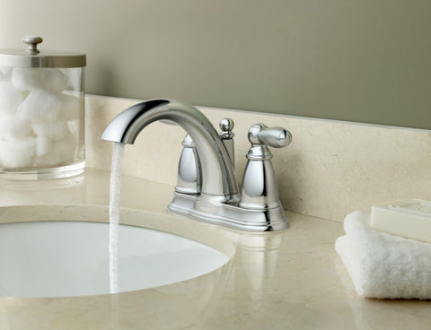 Moen Brantford chrome lever handles provide easy temperature and flow control.