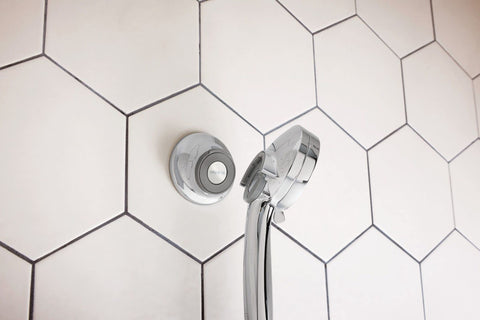 Chrome finish reflects light on Moen Magnetix remote dock
