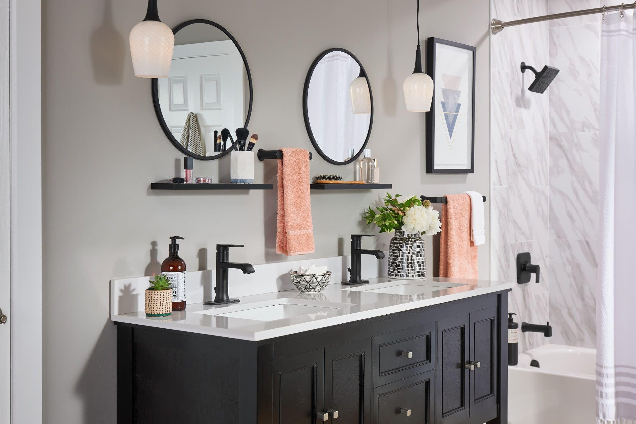 Moen Genta LX matte black tub spout complements bold bathroom design.