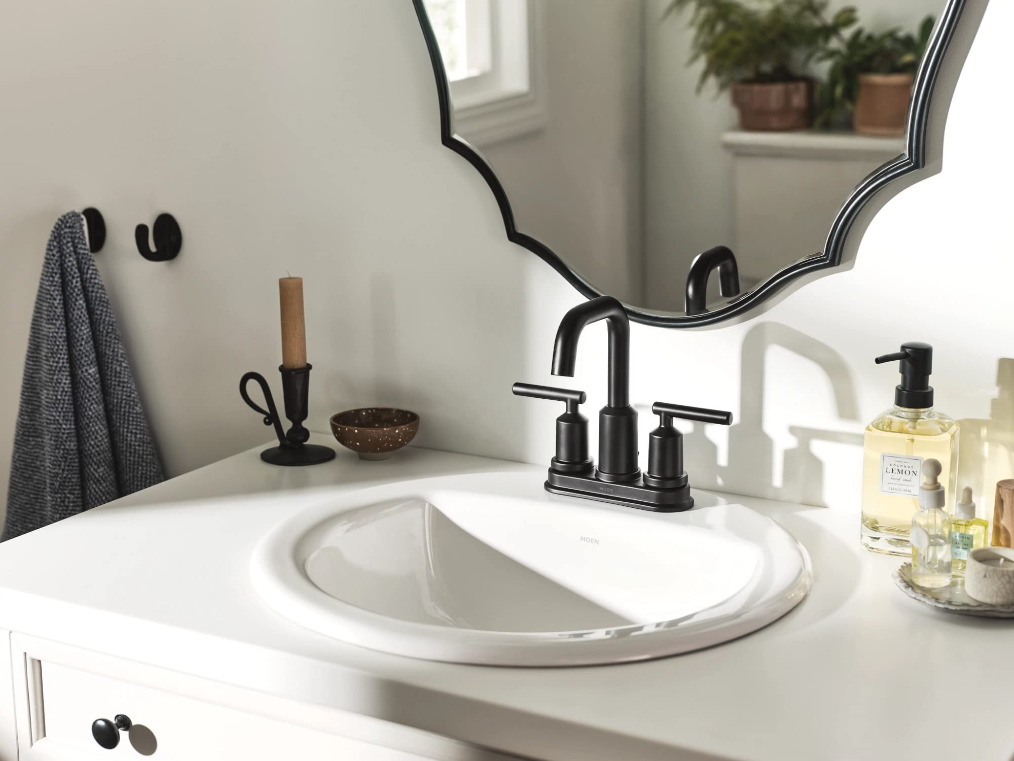 Moen Gibson includes deck plate and drain assembly for a cohesive look.