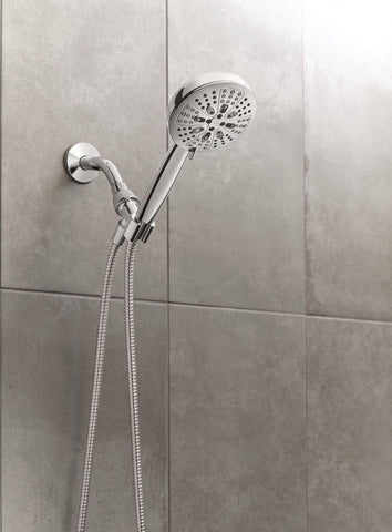 Moen Hydro Energetix handheld shower head for flexible rinsing and reach.