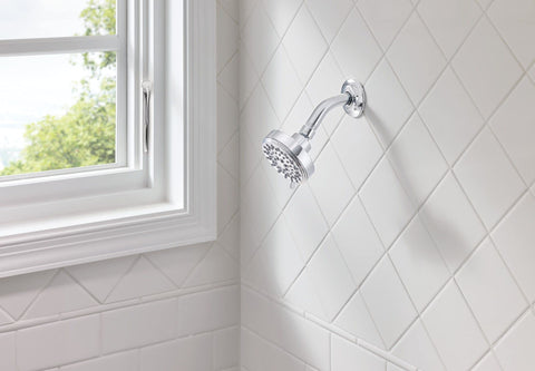Moen Ignite chrome shower head face shows adjustable spray patterns.
