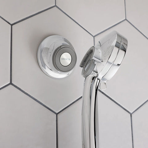 Mounted chrome finish Moen Magnetix remote dock with wall bracket