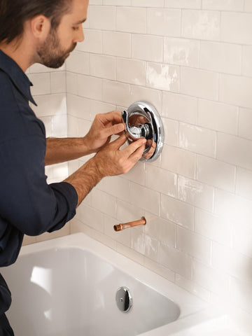 Handheld shower attachment in Moen MDURA kit for flexible rinsing.