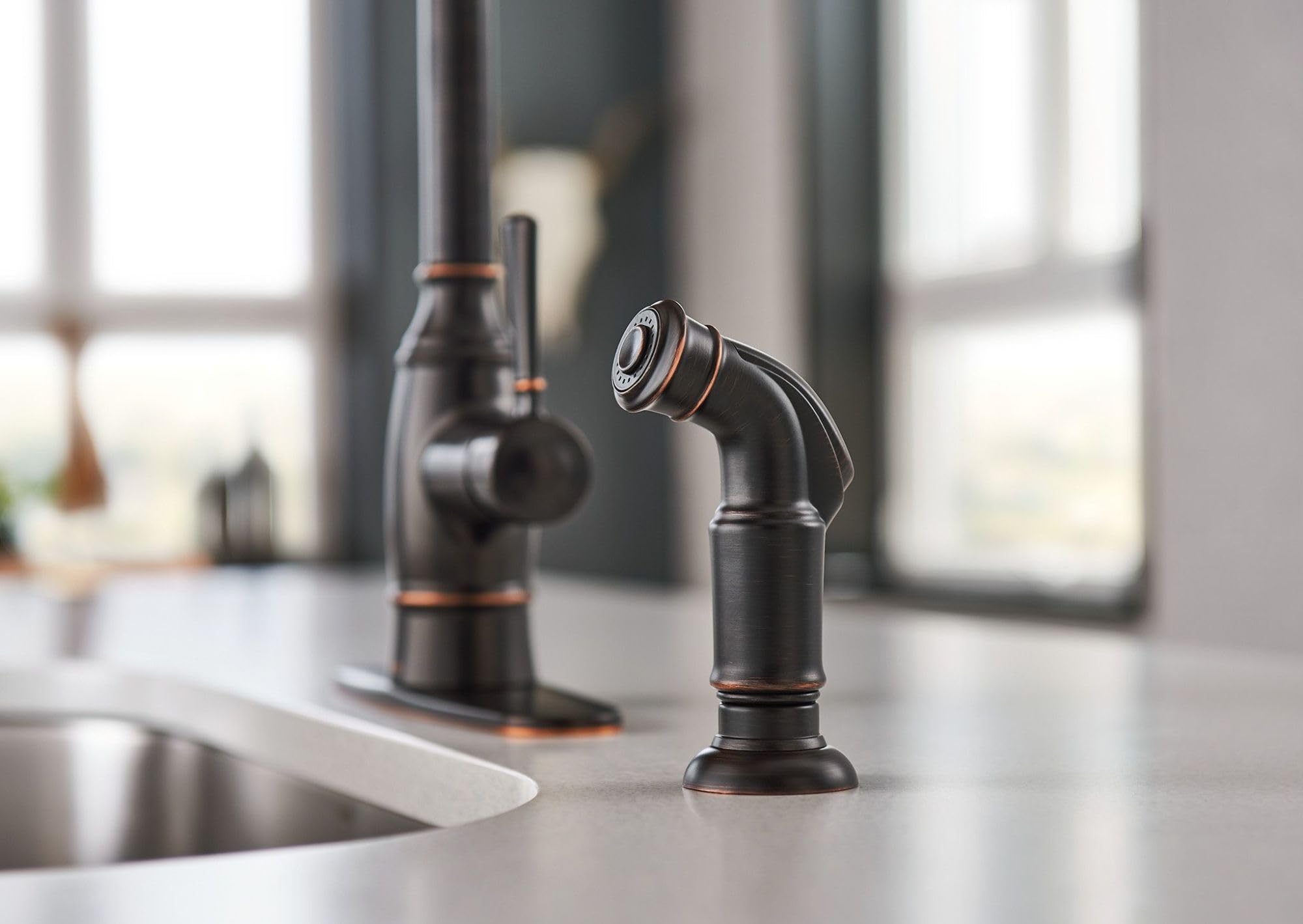 Moen Noell deck plate is optional for a seamless look.